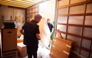 Removal Company Helping A Family Move Out Of Their Old Home